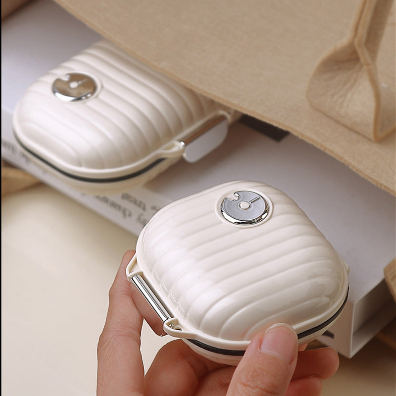 Portable daily pill box