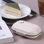Portable daily pill box